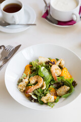 Green salad with shrimps and pumpkin