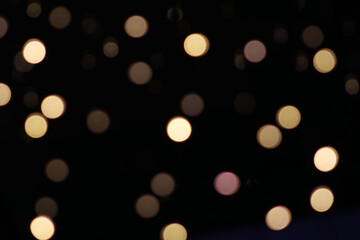 texture of outdoor Christmas lights with black background in different sizes