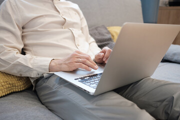 Man working on a laptop at home.