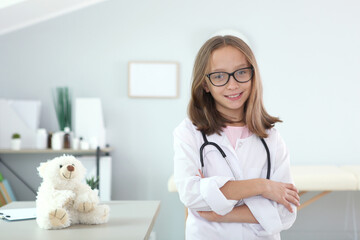 cute girl in good mood plays doctor