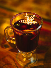 Mulled Christmas wine with orange, spices and snowflake gingerbread cake.