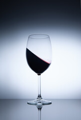 move a glass of red wine on black glass
