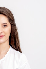 Fototapeta premium Half portrait of young female thepatist looking at camera on white background