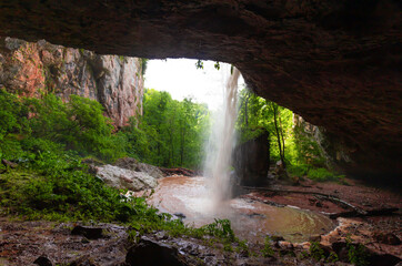 Mountain day summer. Waterfall Caucasus, mainsail cave