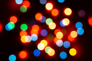 Background of colored bokeh. Multi-colored bright blurred texture of lights.