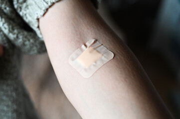 Plaster on the arm after donating blood