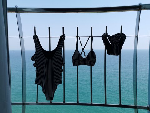 swimming costume drying on hotel balcony during a summer vacation by the Mediterranean Sea in Turkey