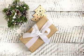 Merry christmas concepts with gift box and ornament element on white wooden table background with copy space