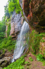 Fototapeta na wymiar Mountain day summer. Waterfall Caucasus