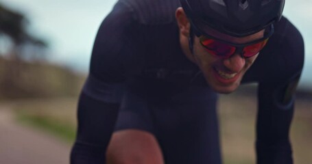 Professional cyclist struggling to ride bicycle during training