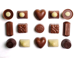 Variety of chocolate truffles isolated on white background.