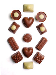Variety of chocolate truffles isolated on white background.
