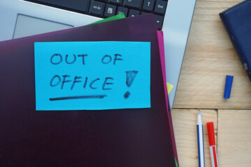 Out of office written on a memo