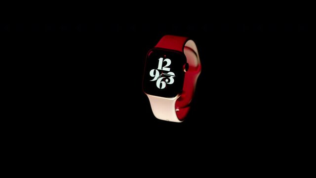 wrist watch spinning in the air on a black background