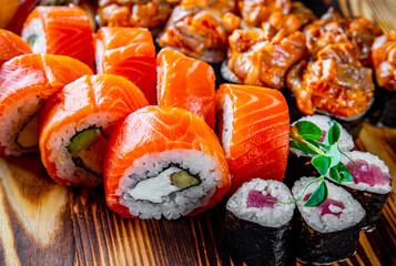 set of sushi roll with salmon, avocado, cream cheese, cucumber, rice, tuna