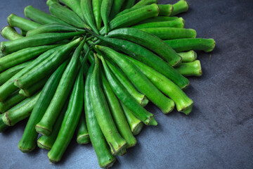 Fresh okra, lady finger, on gray table