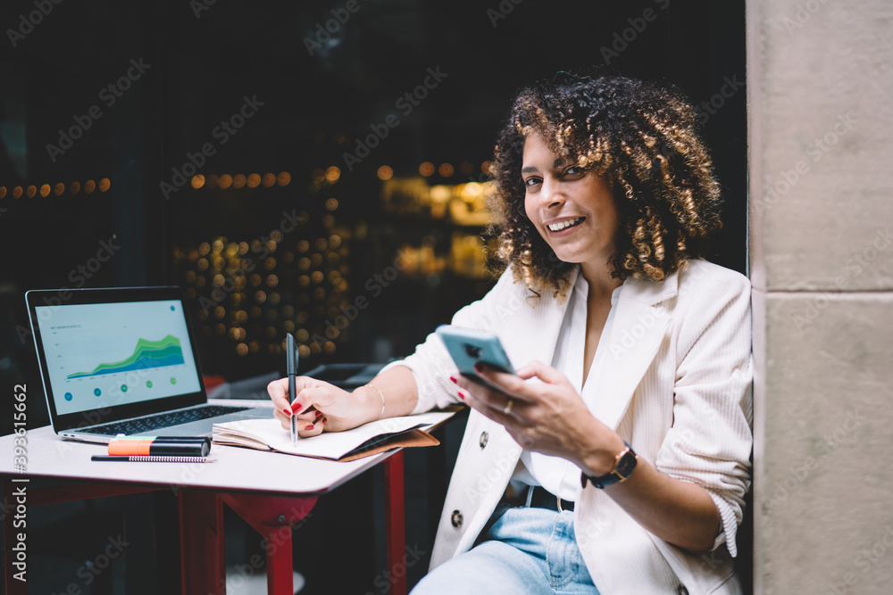 Poster happy female it professional working remotely with projecting and web diagrams displayed on laptop s