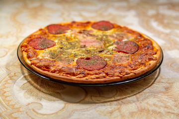 Textured surface of cheese pizza with spices. Homemade fresh baking recipe