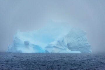 Fototapeta na wymiar iceberg in blue fog