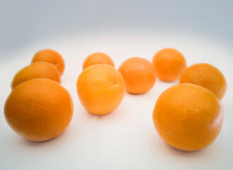 Group of colorful juicy oranges on white background