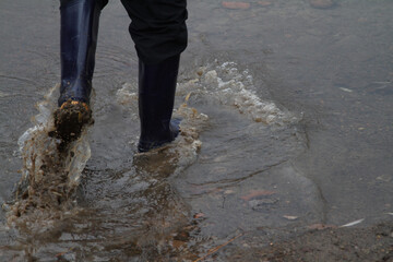 Boots mud puddle walking walking close up