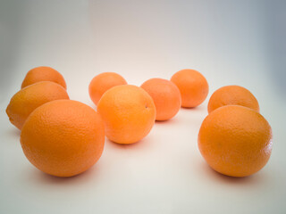 Group of colorful juicy oranges on white background