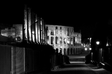 
The monuments of rome in black and white at night
