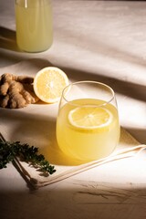 Glass of lemonade with ginger and lemon