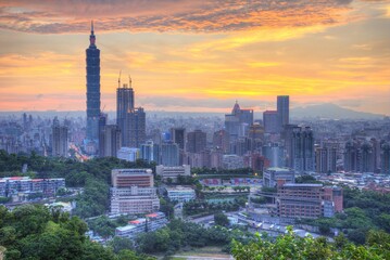 Fototapeta na wymiar Aerial panorama of downtown Taipei City with Taipei 101 Tower among skyscrapers under dramatic sky ~ A romantic evening in Taipei, the capital city of Taiwan, with beautiful rosy afterglow at sunset
