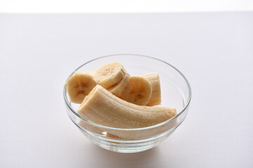 Superfood, vegan ingredients photographed on a high-key background, include bananas, blueberries,...