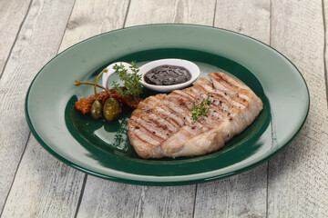 Grilled pork steak with pepper sauce