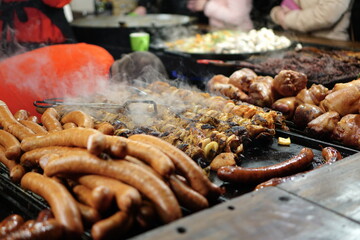 Food booth selling traditional Polish street food at a Christmas Market stall in Krakow, Poland. Traditional Polish street food in Cracow. 