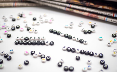 news papers and propaganda fake news and manipulation written in french information communication concept