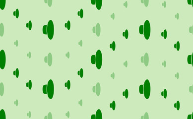 Seamless pattern of large and small green speaker symbols. The elements are arranged in a wavy. Vector illustration on light green background