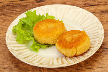 Vegan cuisine - Potato cutlet in the plate