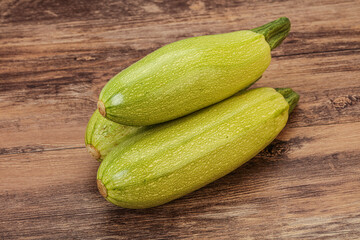 Young tasty zucchini over board