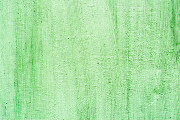 green metal surface with smudges of color