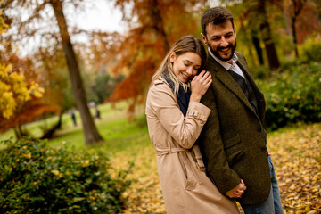 Fototapeta premium Young couple walking in the autumn park