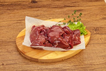 Raw chicken liver over board