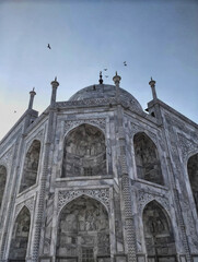 Fototapeta na wymiar Taj Mahal - A white pearl in light blue sky's ocean