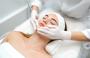 Keuken foto achterwand Schoonheidssalon Woman getting face beauty treatment in medical spa center.