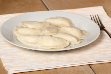 Fototapeta na wymiar Cooked Dumplings on plate