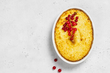 Baked porridge in a baking dish. Space for text.
