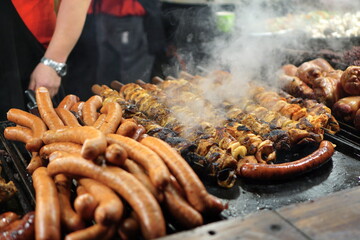 Food booth selling traditional Polish street food at a Christmas Market stall in Krakow, Poland. Traditional Polish street food in Cracow.