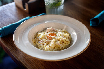 Carbonara pasta with raw egg on a plate