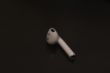 white wireless headphone on black