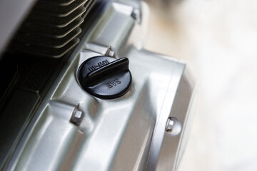 Close-up of an engine oil cap on motorcycle