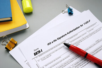 Business concept about Form 8879-I IRS e-file Signature Authorization for 1120-F with sign on the page.