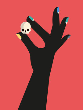 Hand holding a small skull
