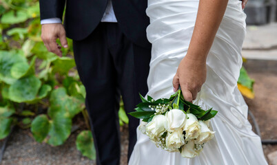 Wedding couple with a beautiful bouquet of bridal flowers for that special day